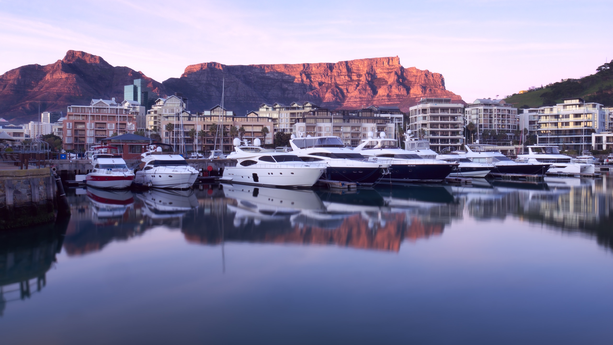 Yachts in Cape Town's V&A Waterfront beneath Table Mountain
