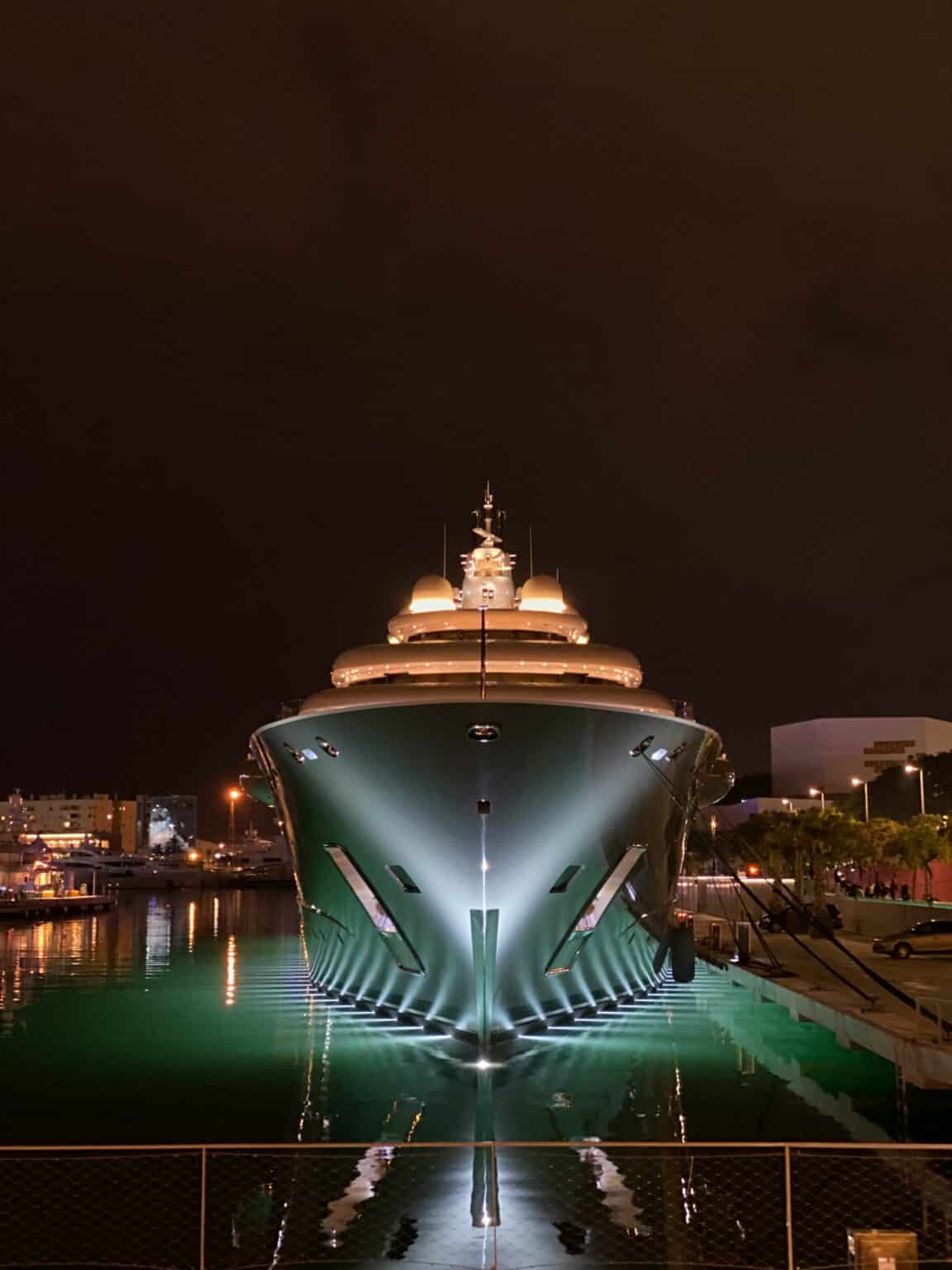 Illuminated superyacht in an international marina